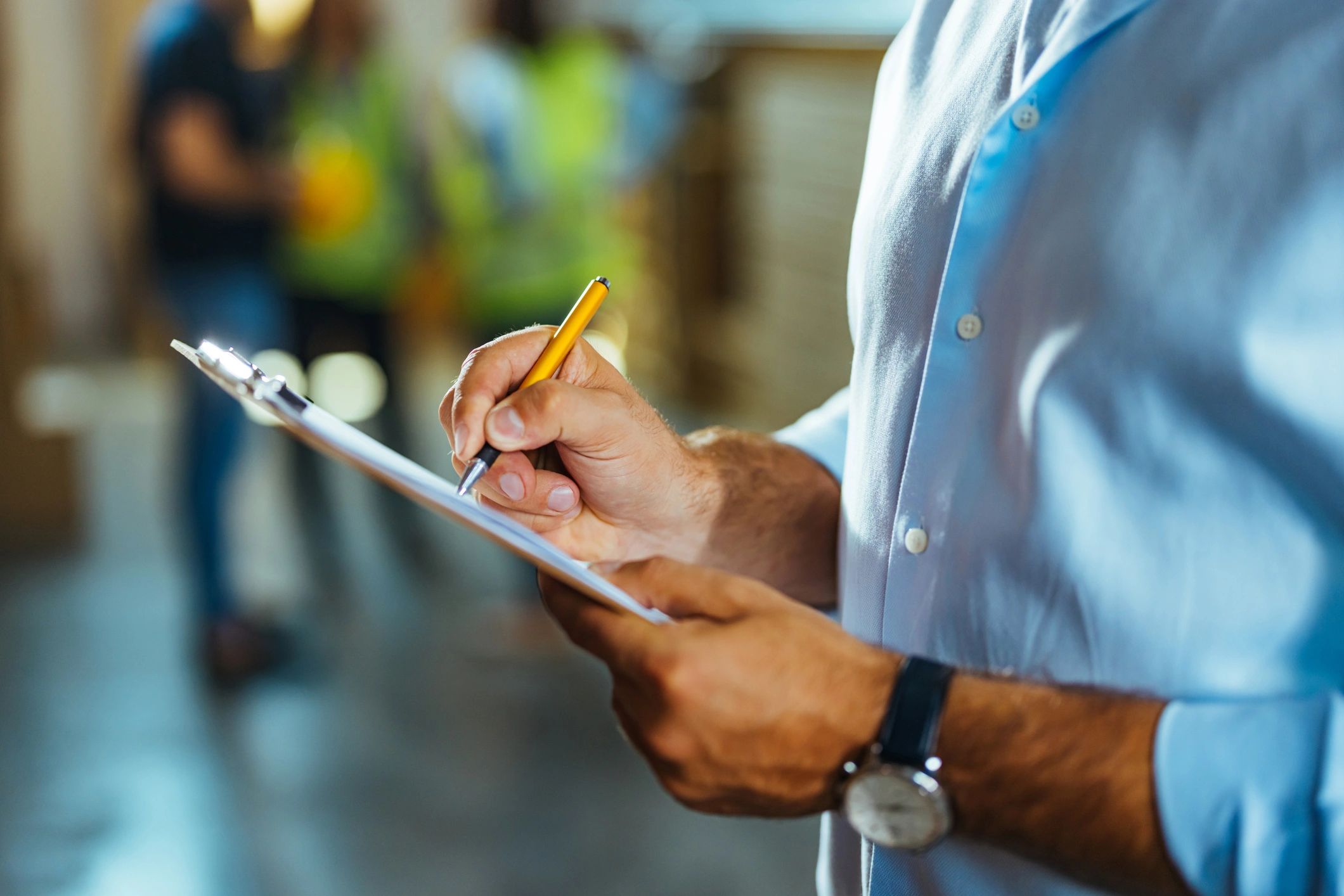 Technician completing a fire safety inspection checklist