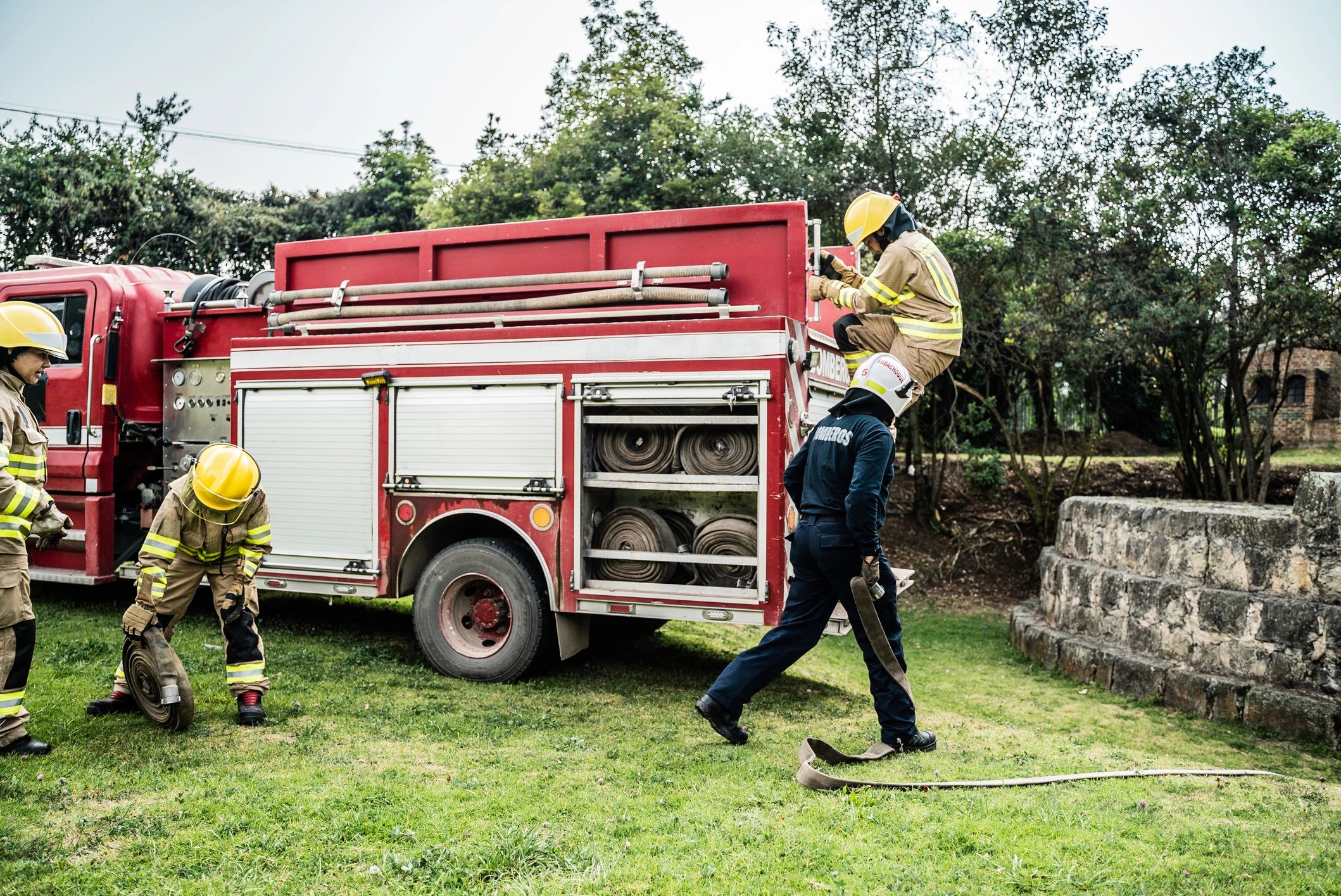 Firefighters preparing equipment during a training exercise