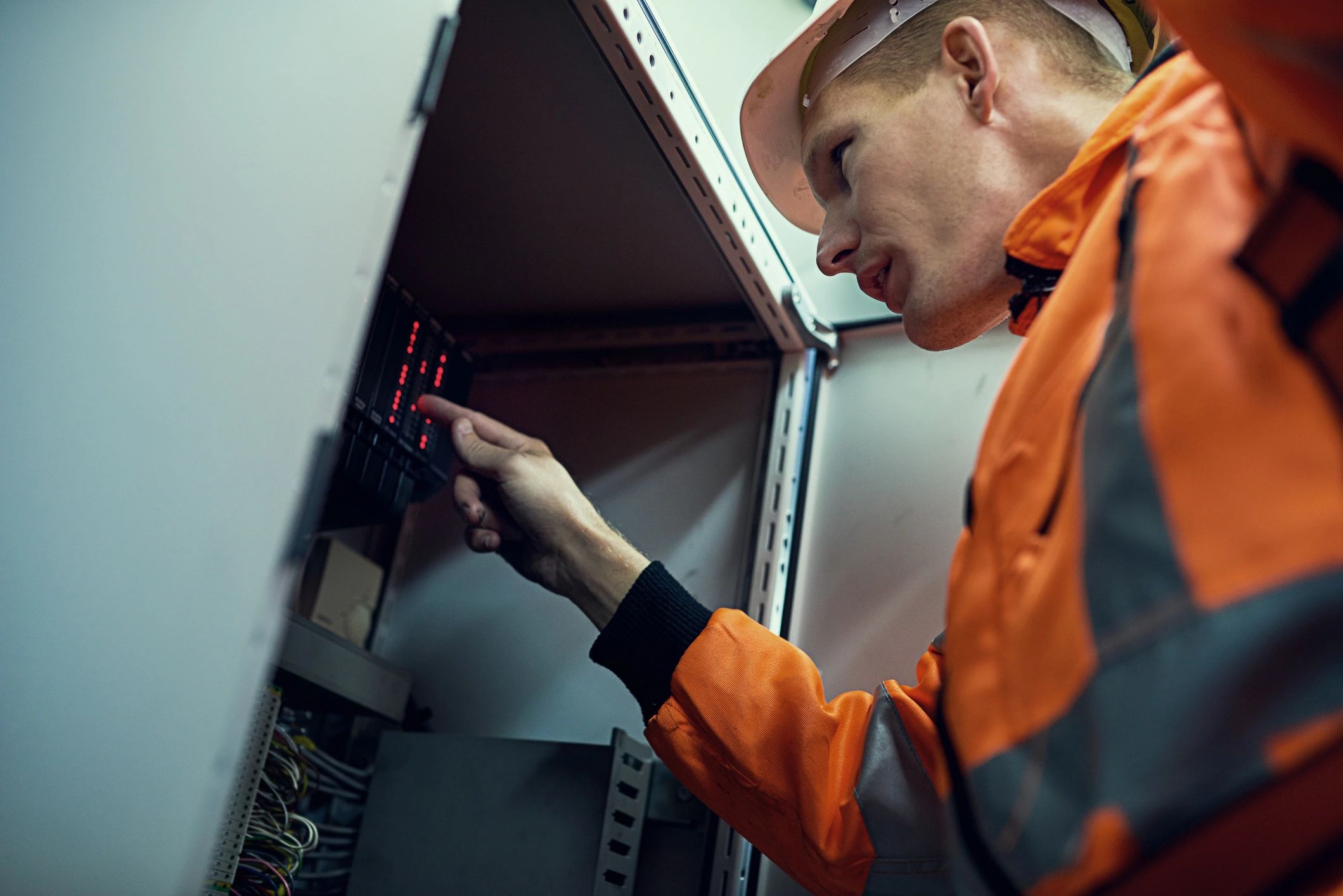 Engineer inspecting a control panel